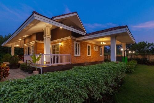 StayVista's Wandering Greens Mountain View Villa with Pool Spacious Lawn & Balcony