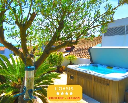L'OASIS Loft standing Terrasse Rooftop Jacuzzi Spa Parking